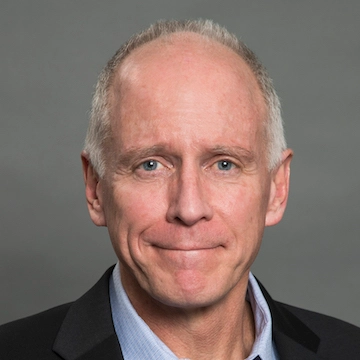a man in a suit and tie posing for a picture