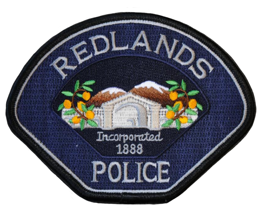 a redlands police badge on a white background