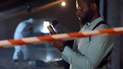 a man holding a cell phone in his hands