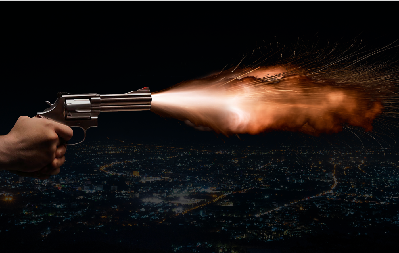 a person holding a gun in the air