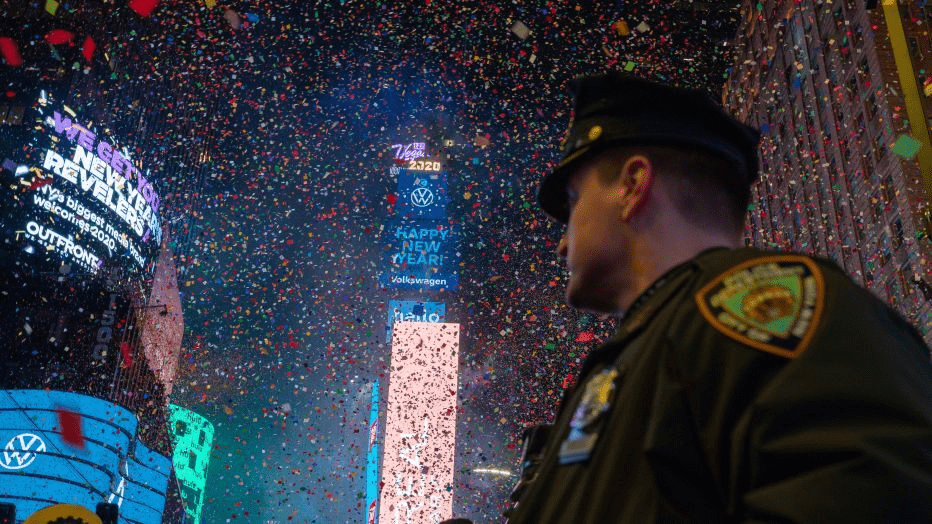 a police officer standing in the middle of confetti