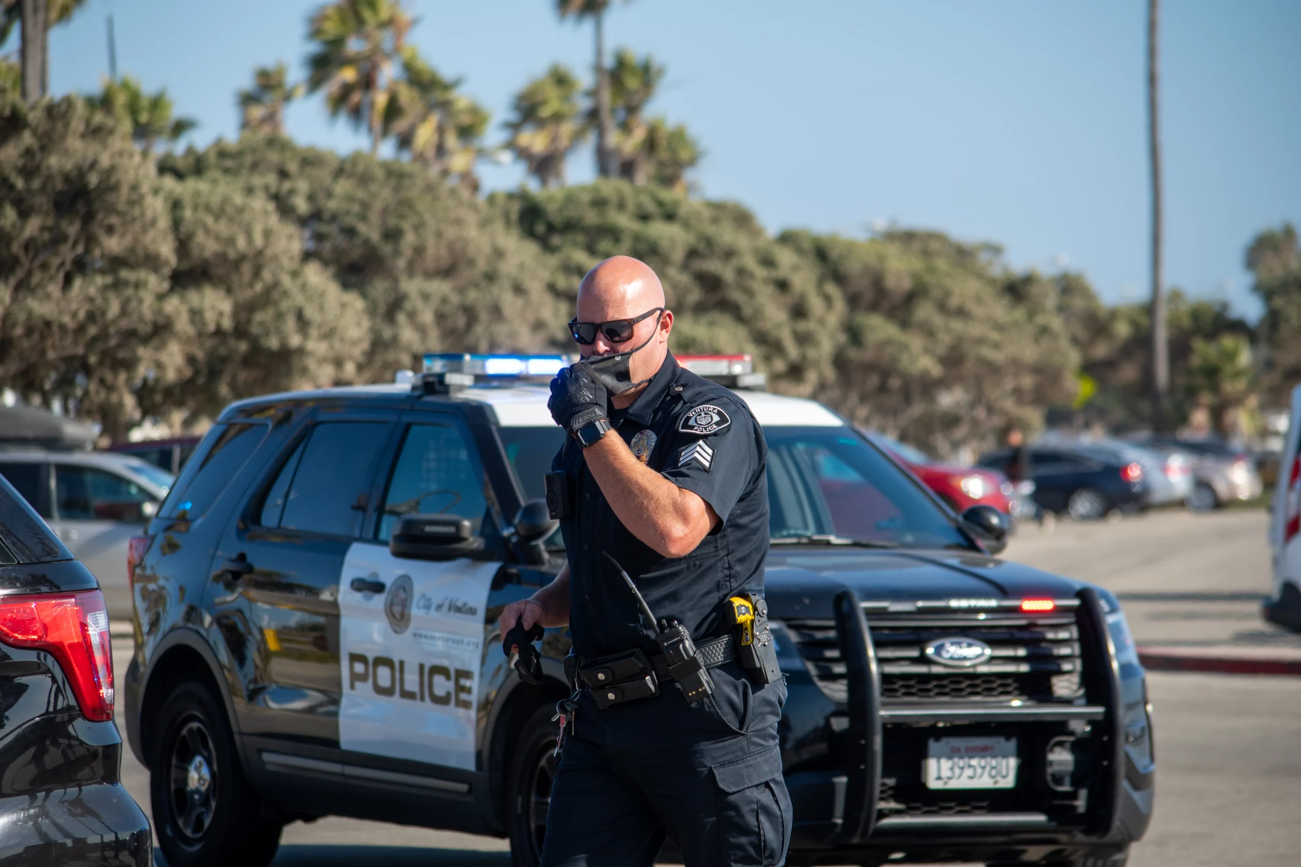 a police officer talking on a cell phone