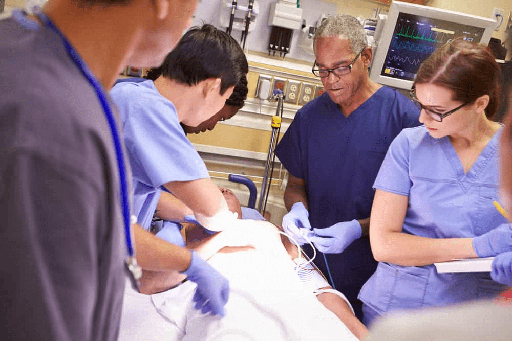 a group of medical personnel performing surgery in a hospital
