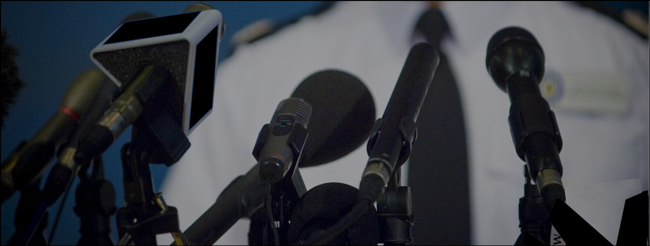 a close up of microphones in front of a man in a uniform