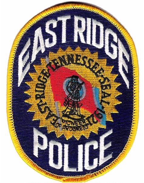 a police badge with the words east ridge police on it