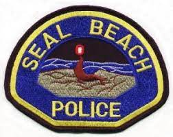 a seal beach police patch on a white background
