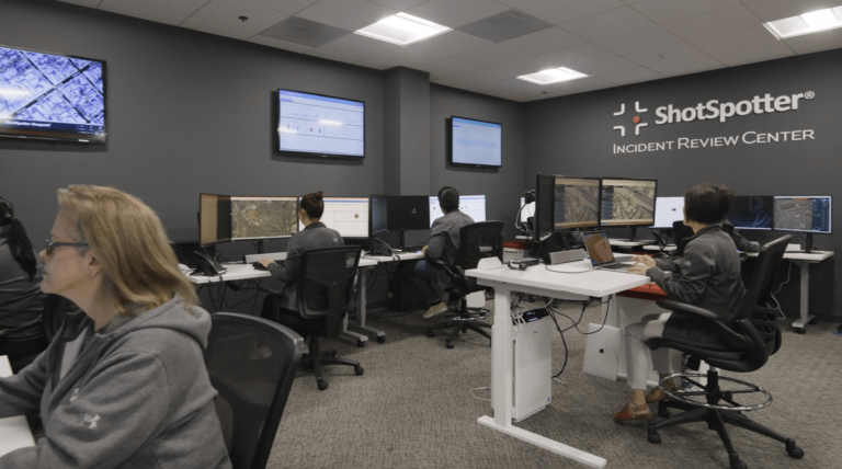 a group of people sitting at computers in a room