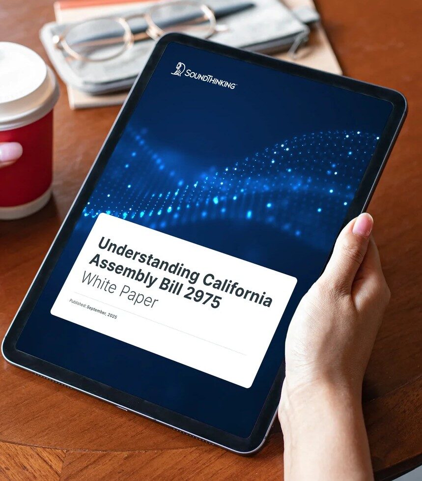 Hand holding a tablet that shows the Understanding California Assembly Bill 2975 White Paper on the tablet.