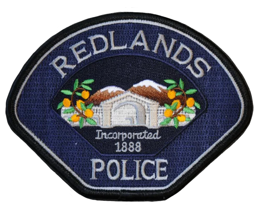 a redlands police badge on a white background
