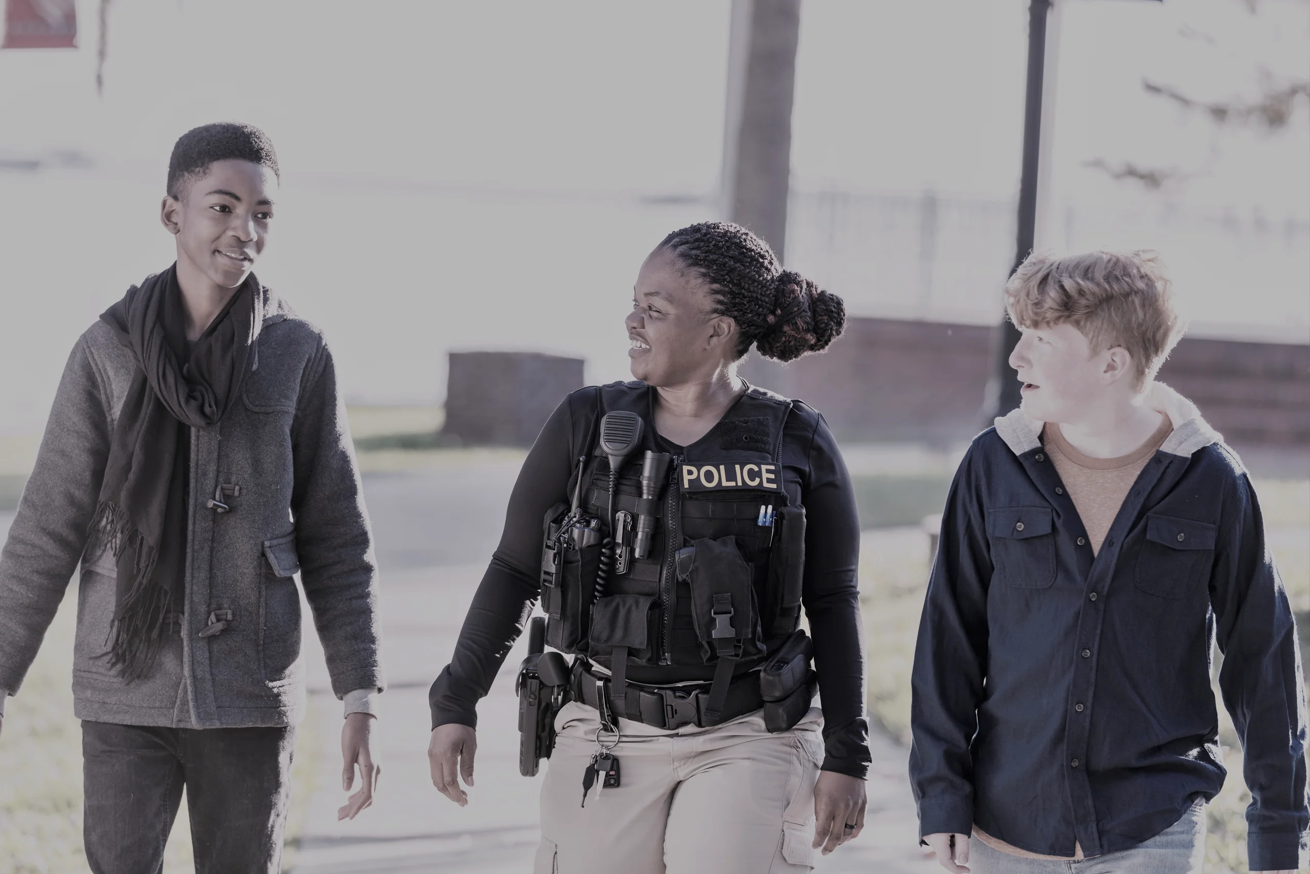a group of young people walking down a street