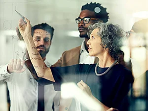 a group of people standing around each other