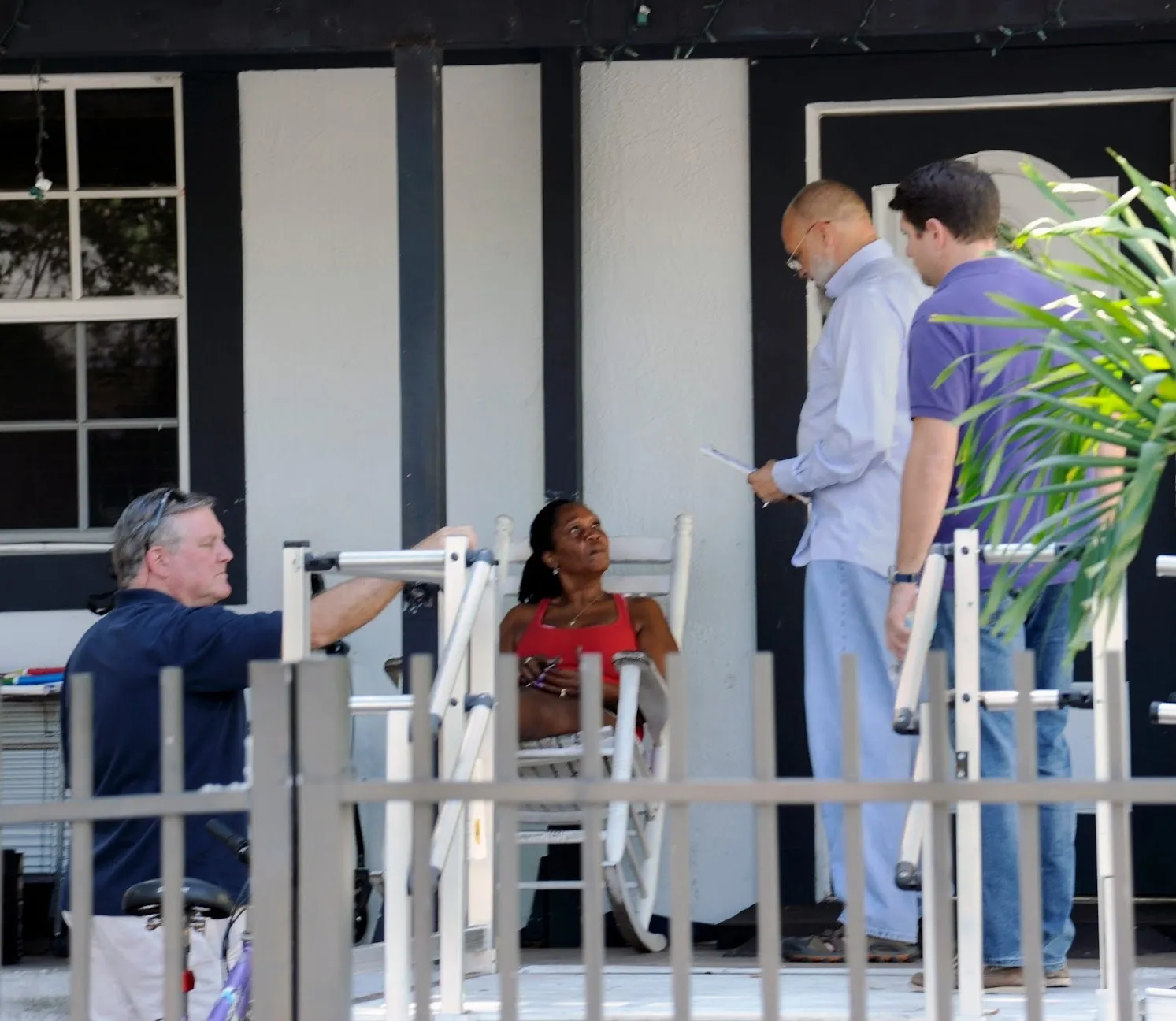 a group of people standing outside of a building