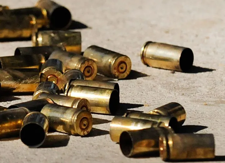 a bunch of bullet shells laying on the ground