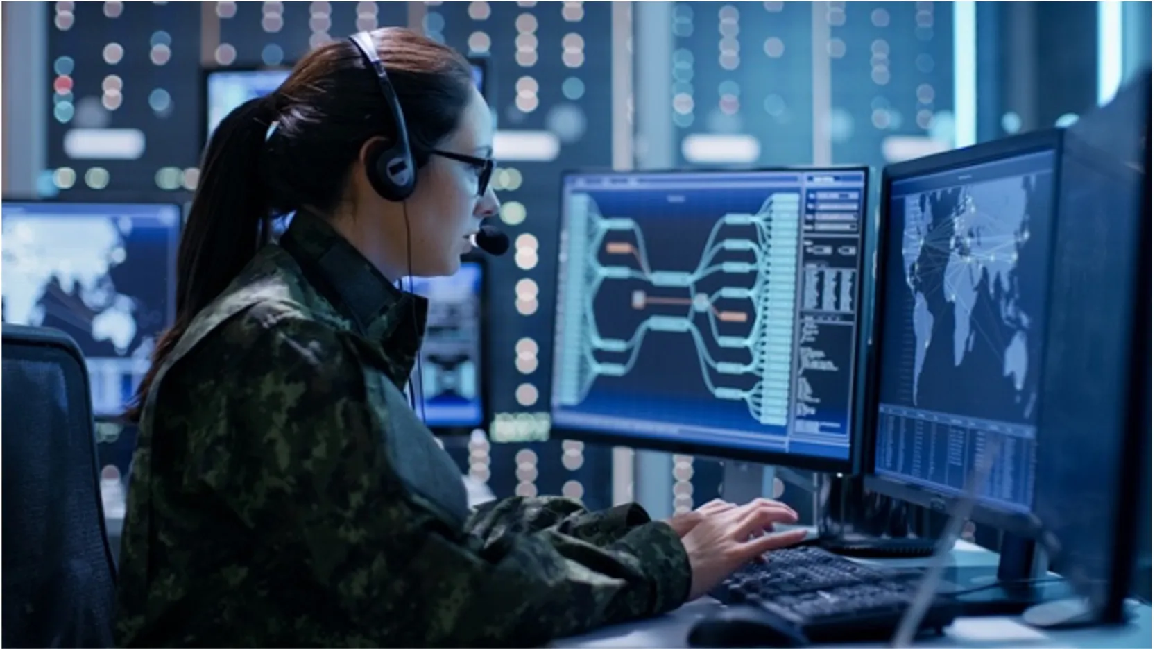a woman in a military uniform using a computer