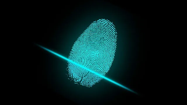 a fingerprint on a black background with a blue light