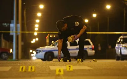 a police officer leaning over on a skateboard