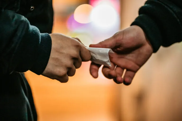 two people are holding something in their hands