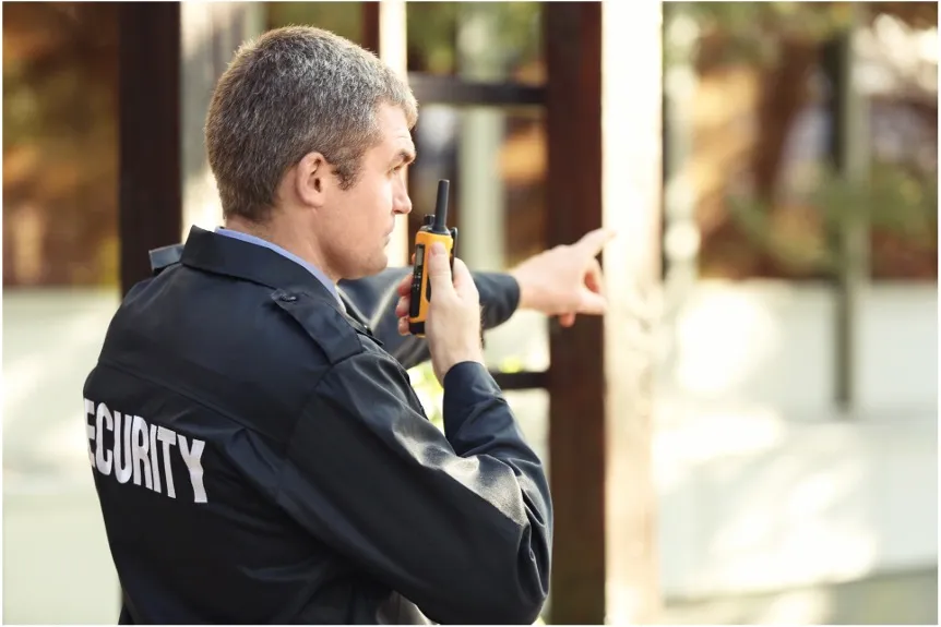 a man in a police uniform holding a beer